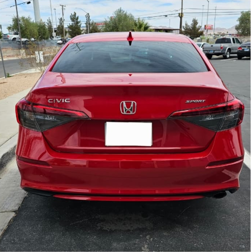 Rear end damage fully repaired with new bumper and quarter panel